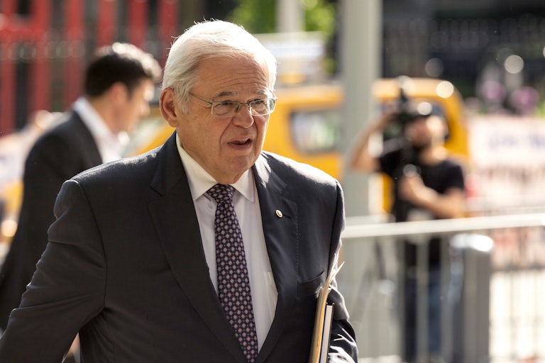 Bob Menendez walks
