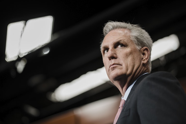 A close up of House minority leader Kevin McCarthy, glancing to the side.