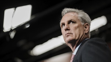 A close-up of House Minority Leader Kevin McCarthy, glancing to the side.