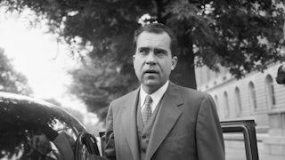 Vice President Richard Nixon speaks with members of the media before leaving his Capitol Hill office in 1956.