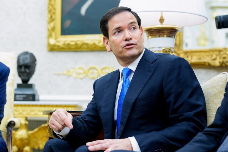 Secretary of State Marco Rubio speaks while sitting on a couch in the Oval Office