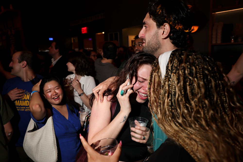 Attendees celebrate Zohran Mamdani’s victory at an official campaign event on Tuesday evening. In this picture a woman is crying and hugging a man