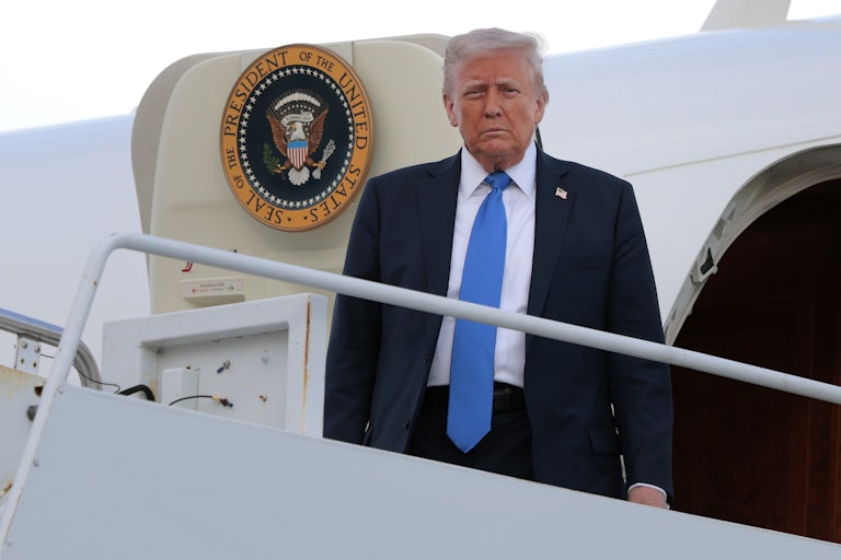 Donald Trump disembarks from Air Force One.