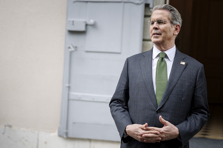 Treasury Secretary Scott Bessent speaks while standing with his hands folded in front of him