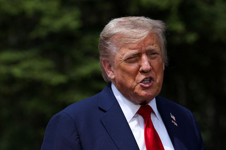 Donald Trump yells outdoors.