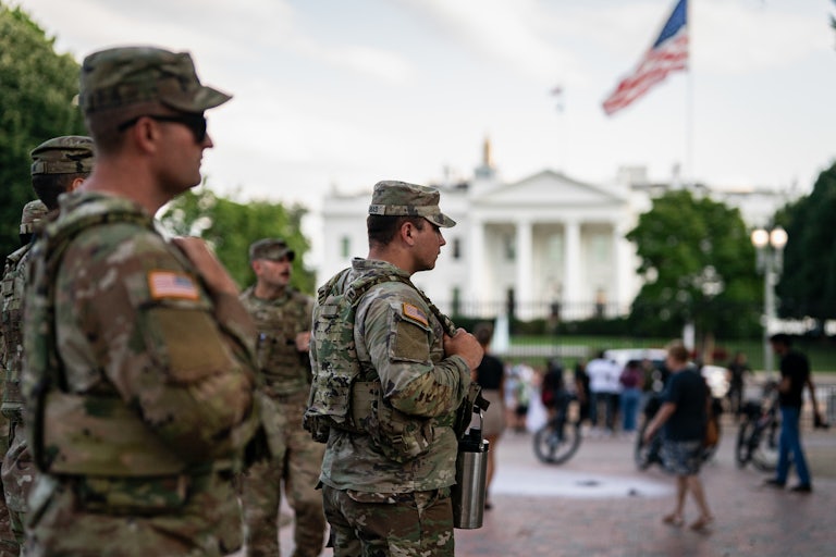 Members of the National Guard stand outside of the White House in Washington, D.C.
