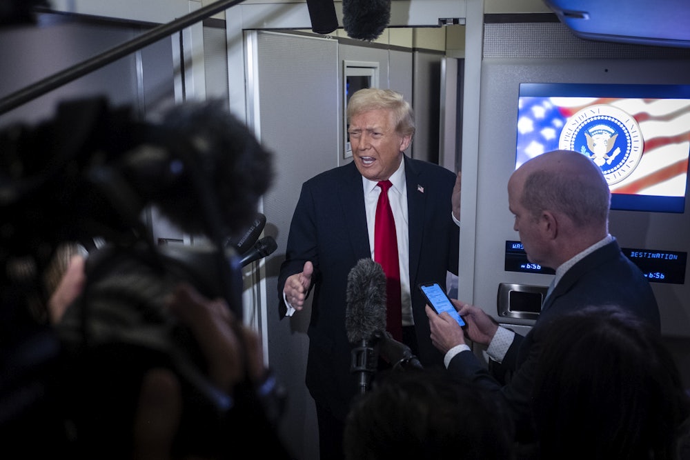 Donald Trump speaks to the media aboard Air Force One.