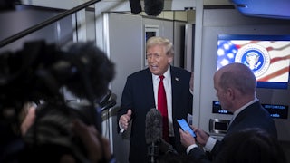 Donald Trump speaks to the media aboard Air Force One.