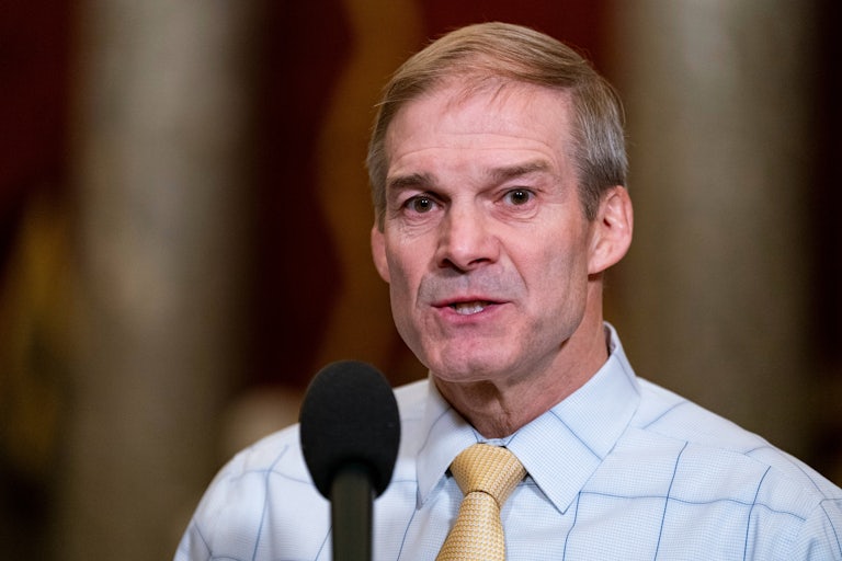 Jim Jordan stands in front of a mic, looks distressed