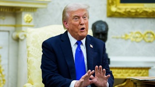 Donald Trump speaks and gestures while sitting in the Oval Office