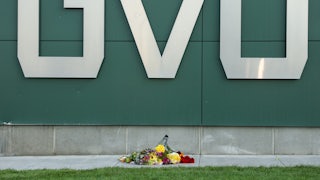 Flowers are left near a sign on the campus at Utah Valley University in Orem, Utah, on September 11, 2025, where political activist Charlie Kirk was shot and killed on September 10. Utah has some of the most permissive gun laws in the country.