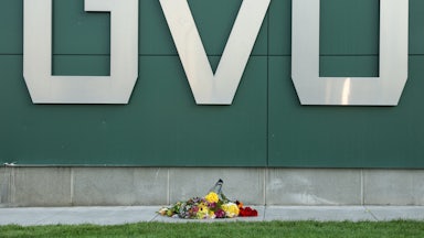 Flowers are left near a sign on the campus at Utah Valley University in Orem, Utah, on September 11, 2025, where political activist Charlie Kirk was shot and killed on September 10. Utah has some of the most permissive gun laws in the country.