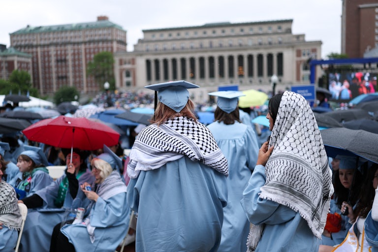 Columbia University students wear keffiyehs to graduation