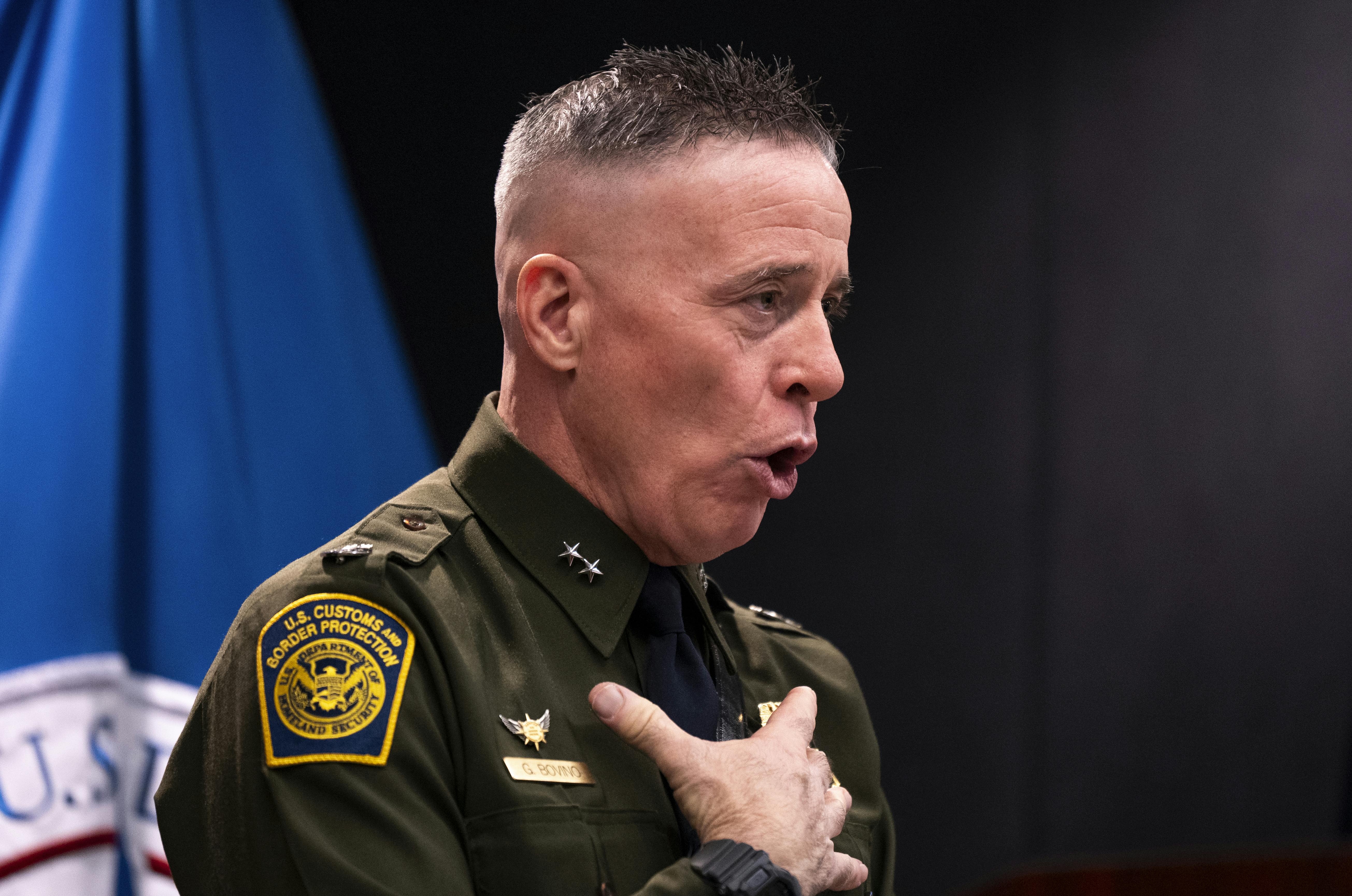 CBP Commander Gregory Bovino touches his chest and speaks during a press conference