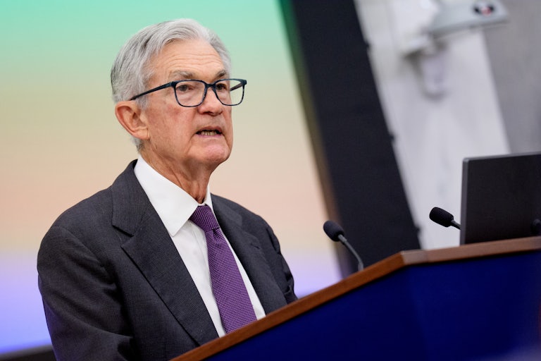 Federal Reserve Chair Jerome Powell speaks at a podium.