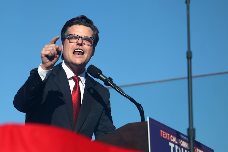 Matt Gaetz gestures while speaking at a podium
