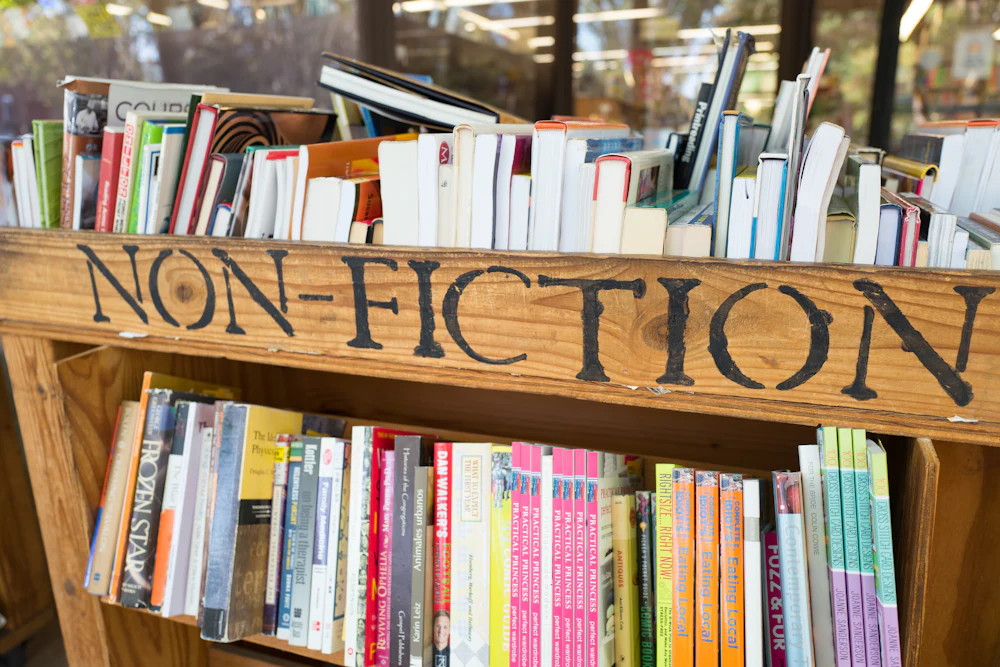 cart of books with a sign reading "non-fiction"