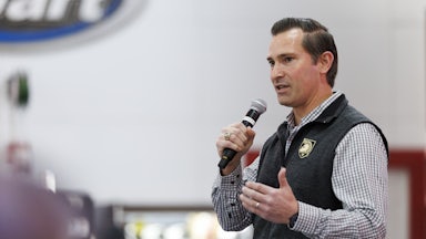Matt Van Epps holds a microphone and speaks into it during a campaign event