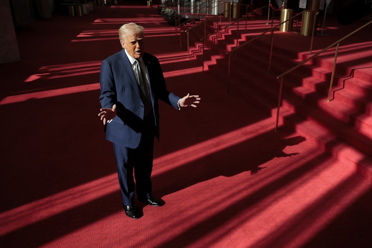Donald Trump gestures while speaking to reporters in the Kennedy Center