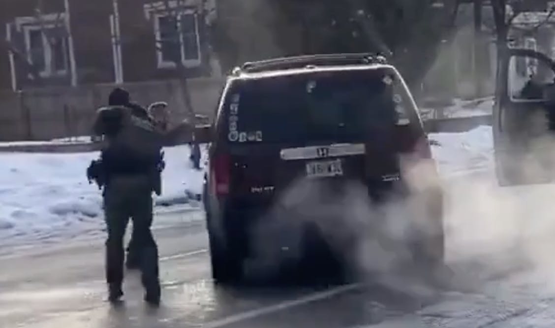 an ICE officer fires into the drivers side window of a SUV