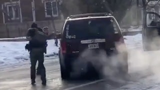 an ICE officer fires into the drivers side window of a SUV