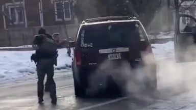 an ICE officer fires into the drivers side window of a SUV