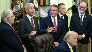 President Donald Trump falls asleep as Secretary of Energy Chris Wright speaks behind him. Others stand around them, including Secretary of the Interior Doug Burgum.