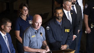 Utah Governor Spencer Cox speaks at a press conference flanked by FBI director Kash Patel, Lieutenant Governor of Utah Deidre Henderson, and Commissioner Beau Mason.