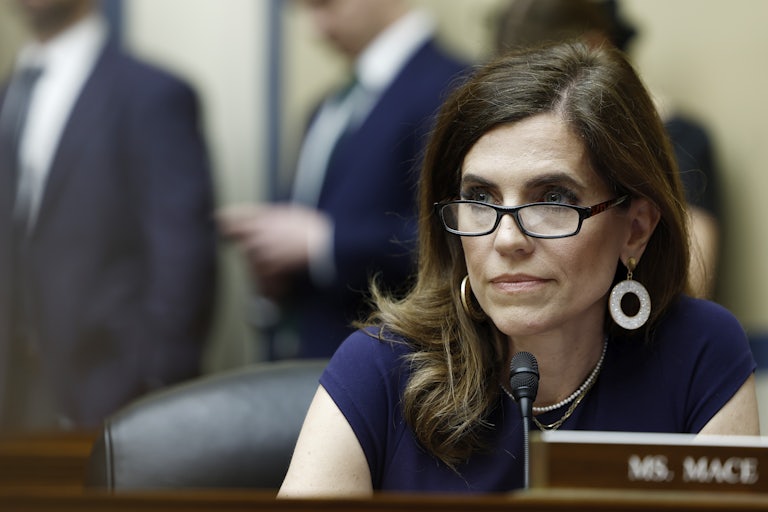 Nancy Mace sits in front of a microphone
