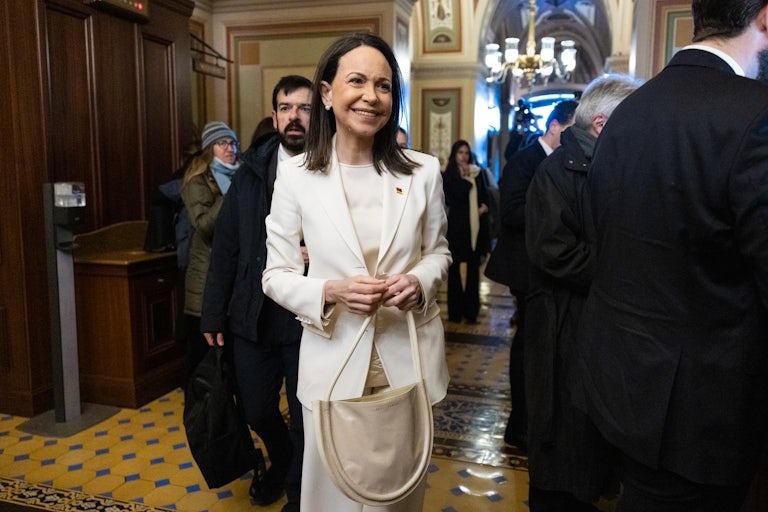 Venezuelan opposition leader Maria Corina Machado smiles as she walks in Capitol Hill