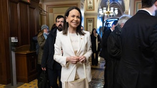 Venezuelan opposition leader Maria Corina Machado smiles as she walks in Capitol Hill
