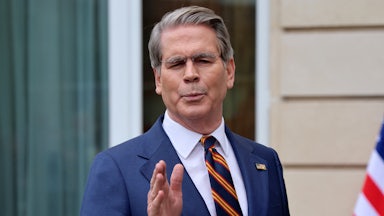 Treasury Secretary Scott Bessent gestures while speaking to reporters