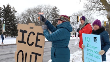 People protest against ICE in Rochester, New York.