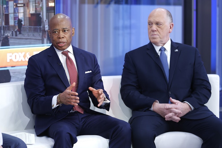 New York City Mayor Eric Adams gestures and speaks while sitting next to Tom Homan during an appearance on Fox & Friends