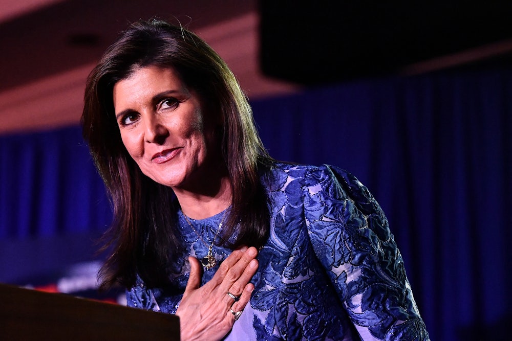Nikki Haley smiles and puts her hand over her heart after losing the New Hampshire primary in January