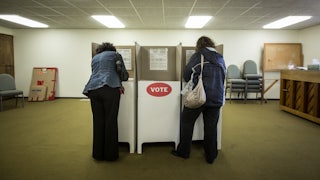 Two people vote at a polling station in Oklahoma City