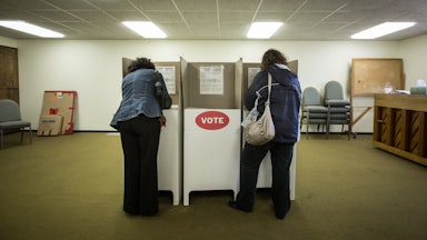 Two people vote at a polling station in Oklahoma City