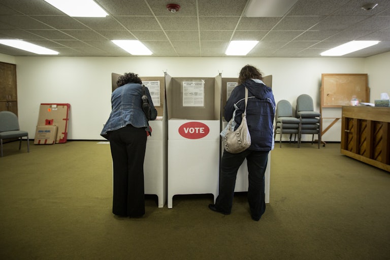 Two people vote at a polling station in Oklahoma City