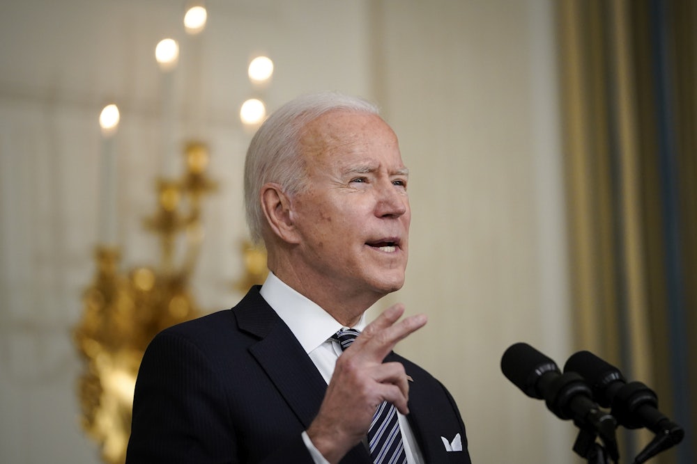 President Joe Biden speaks at a podium.