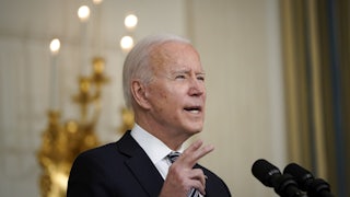 President Joe Biden speaks at a podium.