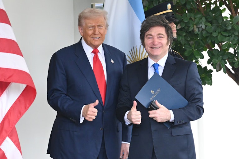 Donald Trump and Argentine President Javier Milei smile and make a thumbs up while standing outside the White House.