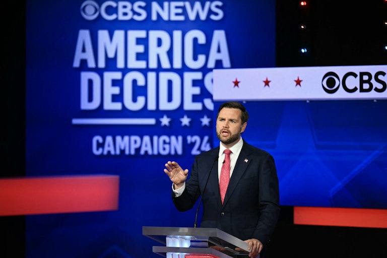 J.D. Vance gestures while speaking on the vice presidential debate stage