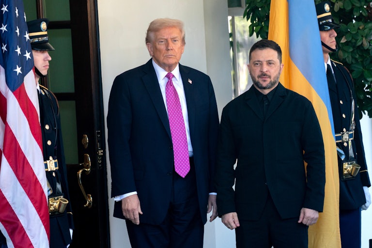 Donald Trump and Ukrainian President Volodymyr Zelenskiy stand next to each other at the White House entrance