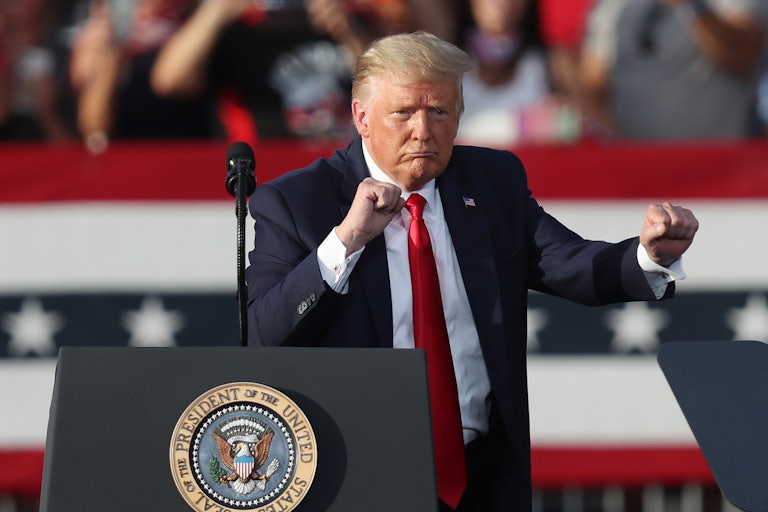 Donald Trump dances at a podium