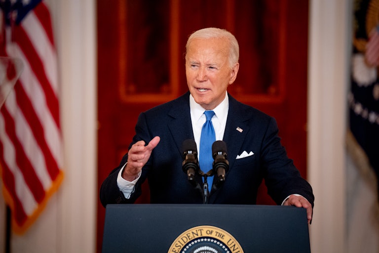 President Joe Biden speaks at a podium