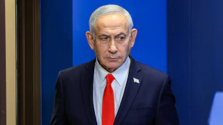 Israeli Prime Minister Benjamin Netanyahu looks to the side