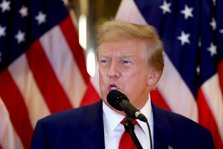 Donald Trump speaks into a microphone