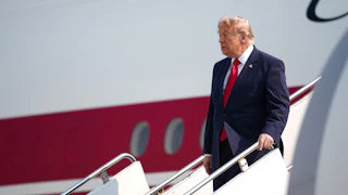 Donald Trump disembarks from Air Force One