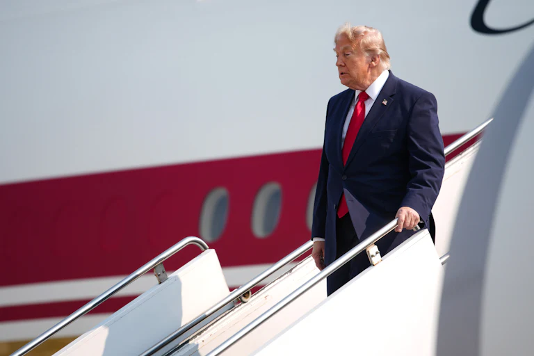 Donald Trump disembarks from Air Force One