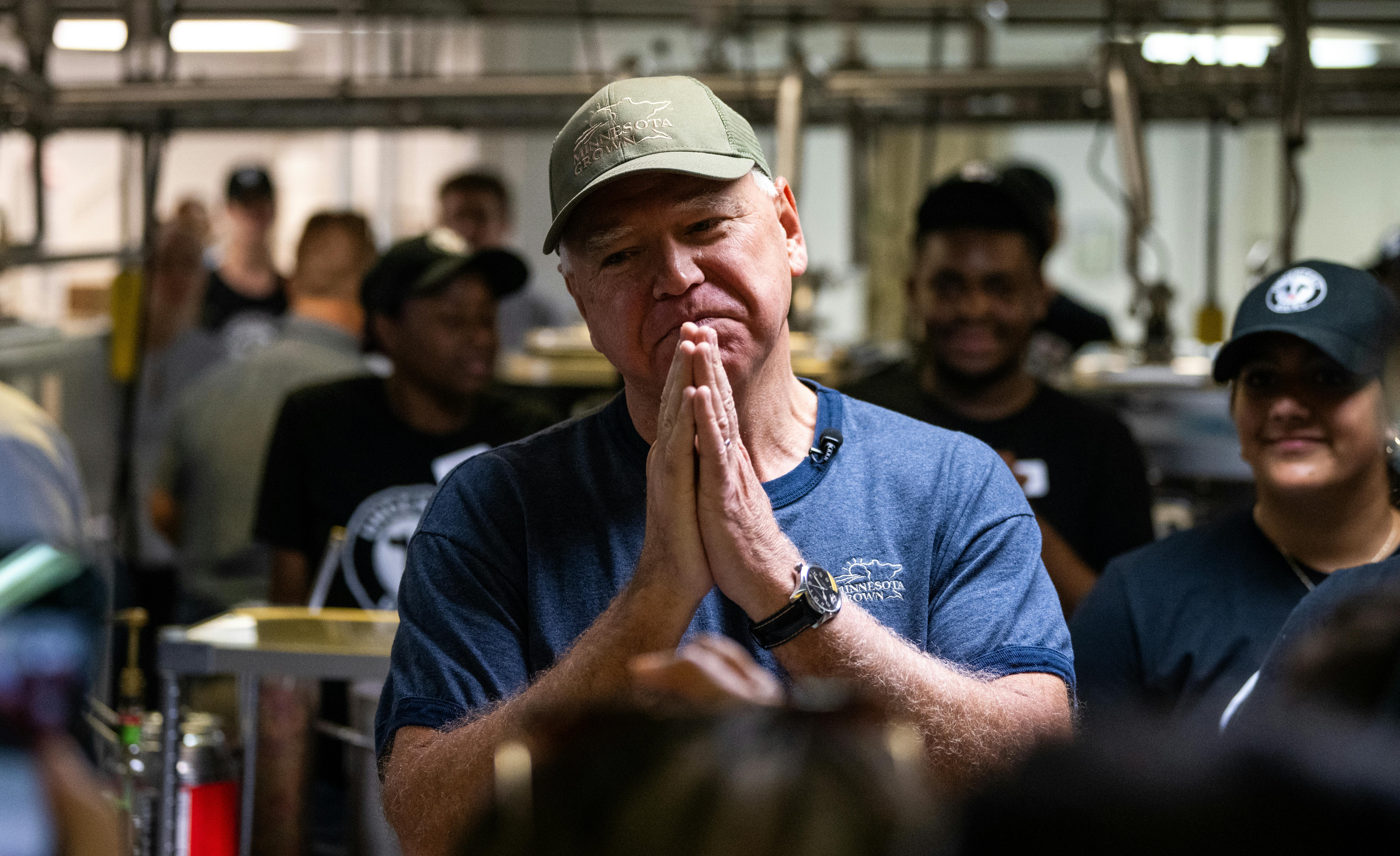 Tim Walz thanks supporters after serving ice cream at the Dairy Barn in the Minnesota State Fair.